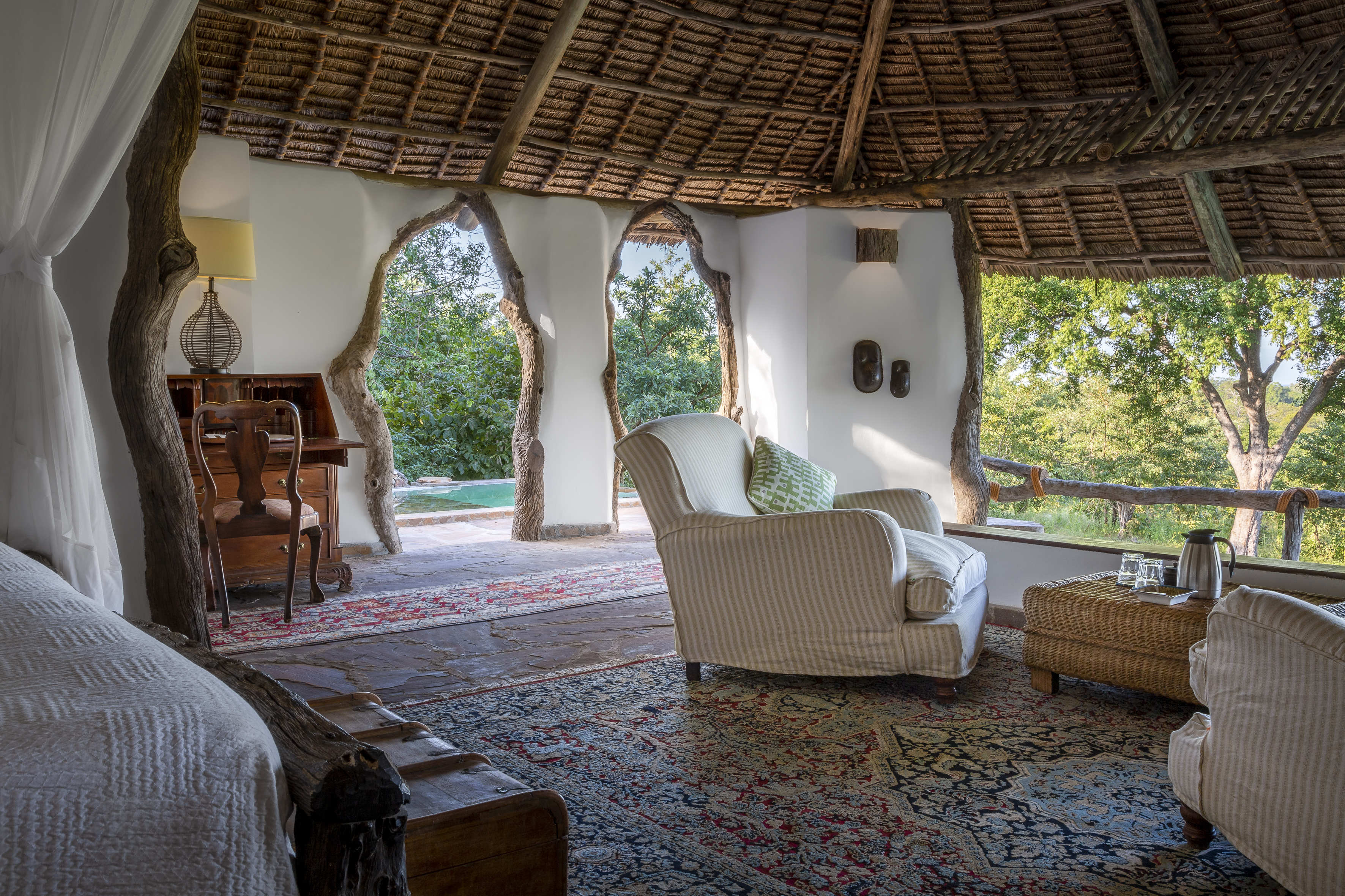 Banda interior with open front wall and bush views